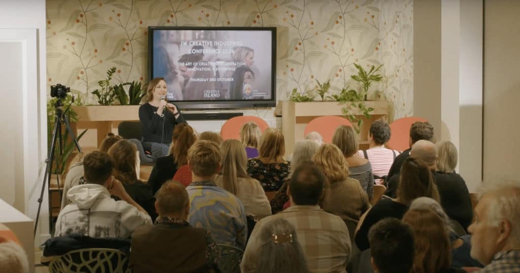 Georgia Newman on stage at the conference